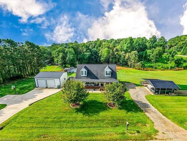 3.2 Acres of Land with Home for Sale in Roaring River, North Carolina