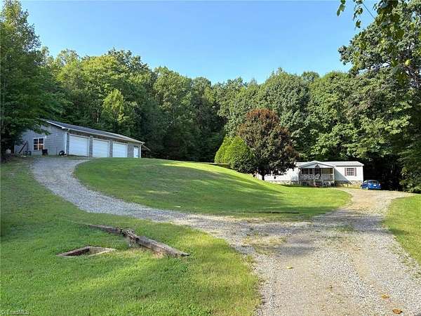 8 Acres of Land with Home for Sale in Stokesdale, North Carolina