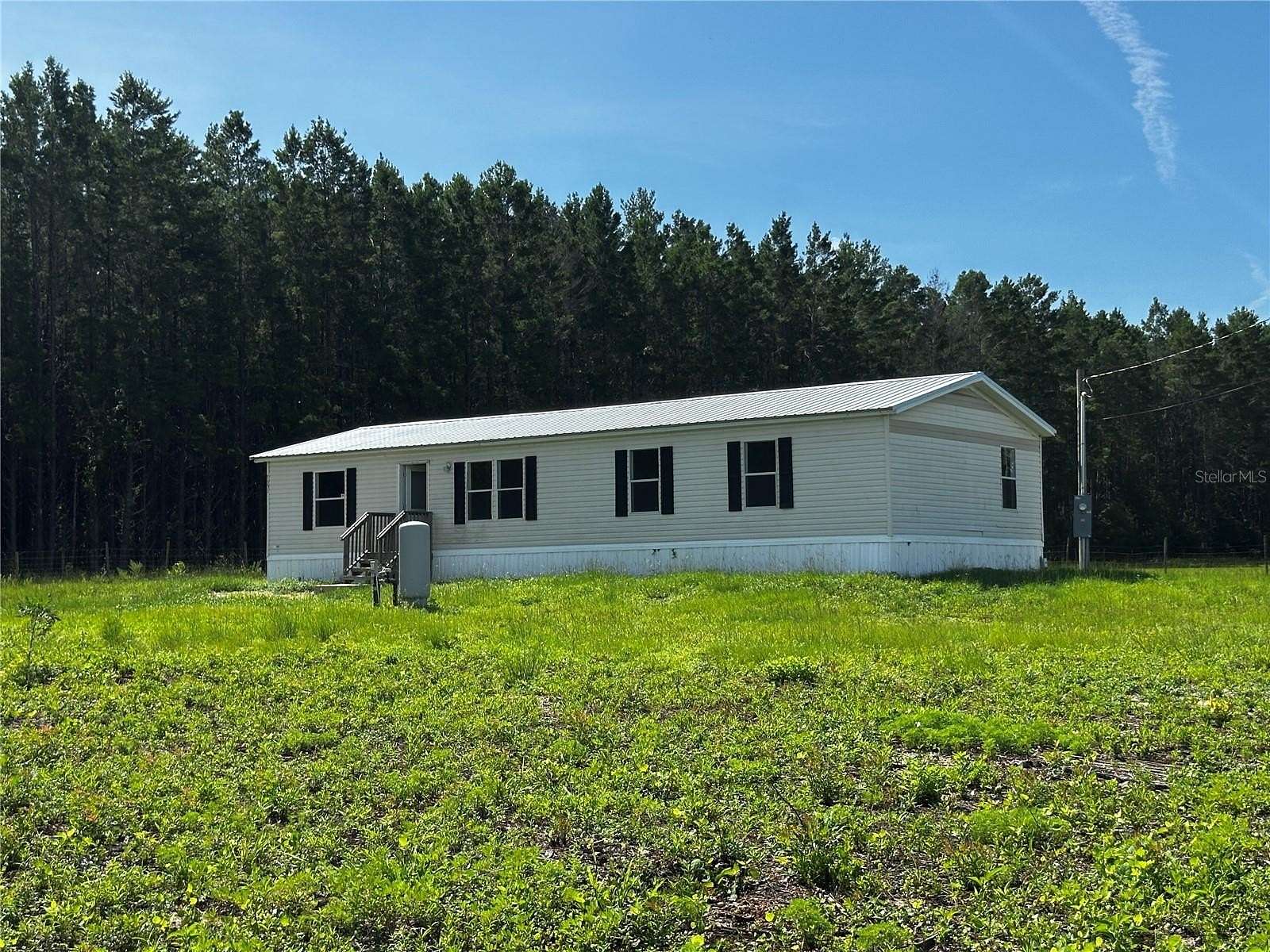 5 Acres of Land with Home for Sale in Bronson, Florida