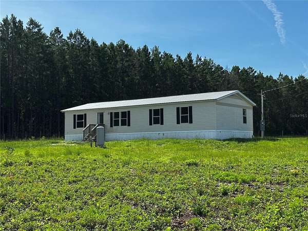 5 Acres of Land with Home for Sale in Bronson, Florida