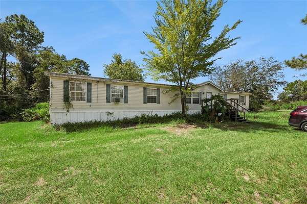 10 Acres of Recreational Land with Home for Sale in Osteen, Florida