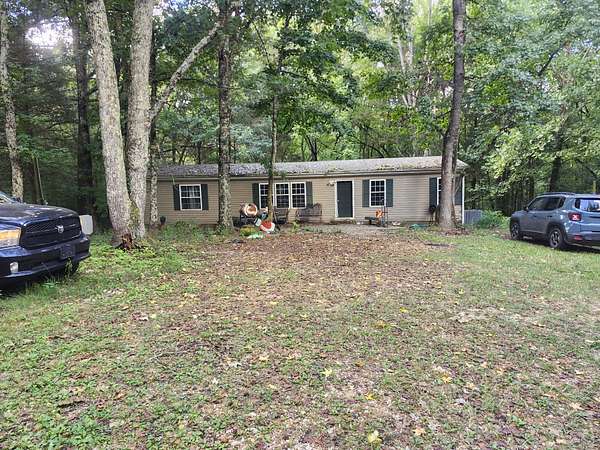 10.2 Acres of Land with Home for Sale in Puryear, Tennessee