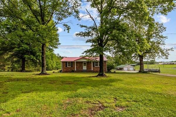4.57 Acres of Land with Home for Sale in Camden, Tennessee