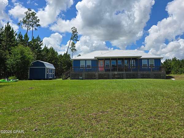1.64 Acres of Land with Home for Sale in Wewahitchka, Florida