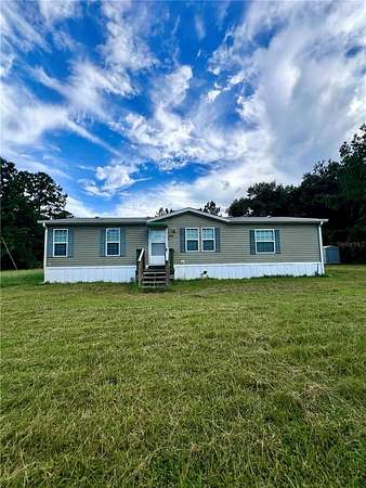 1.56 Acres of Land with Home for Sale in Palatka, Florida