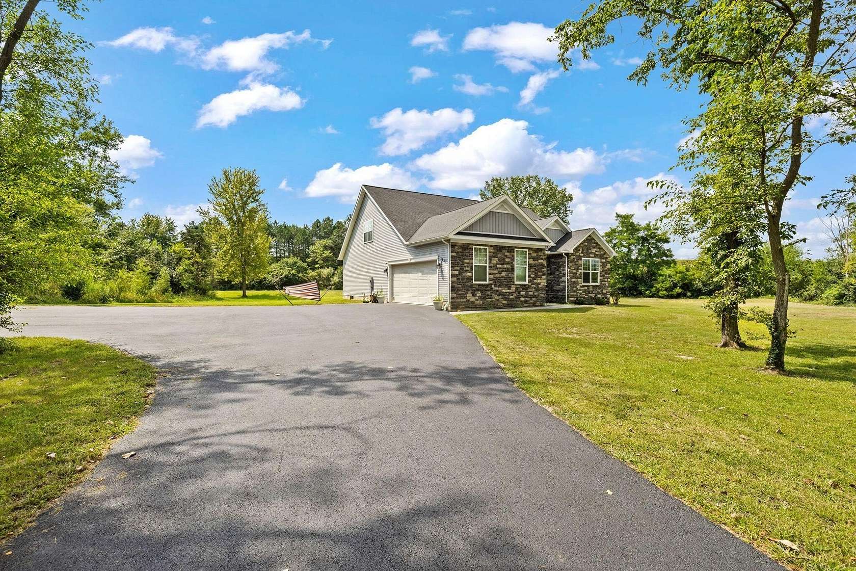 5 Acres of Land with Home for Sale in Huntsville, Ohio