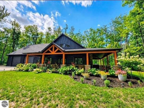 1.76 Acres of Land with Home for Sale in Mancelona, Michigan