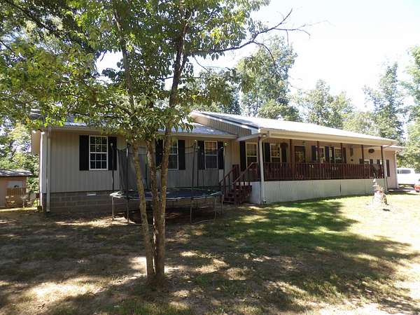 22.1 Acres of Land with Home for Sale in Parsons, Tennessee