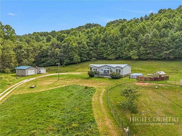 7 Acres of Land with Home for Sale in Crumpler, North Carolina