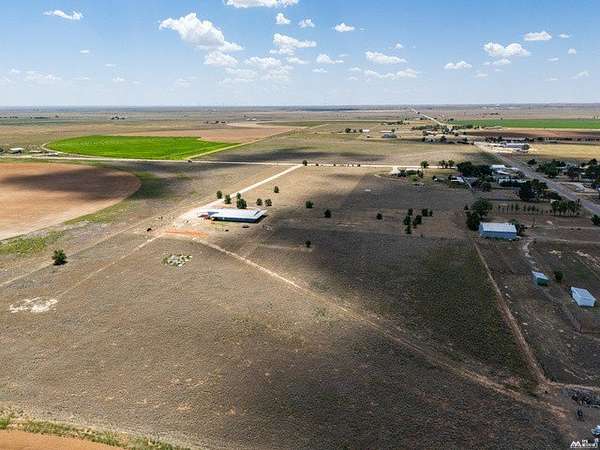 15.6 Acres of Land with Home for Sale in Portales, New Mexico