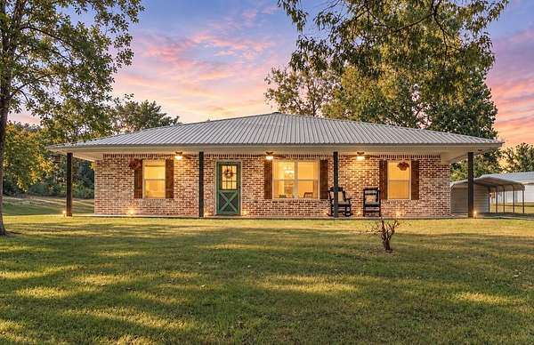 12.3 Acres of Land with Home for Sale in Elkhart, Texas