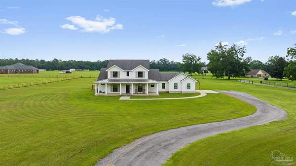 4.15 Acres of Land with Home for Sale in Molino, Florida