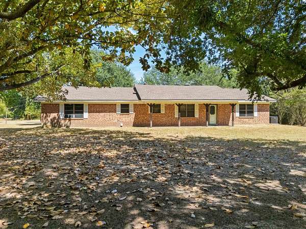 2 Acres of Land with Home for Sale in Carthage, Texas