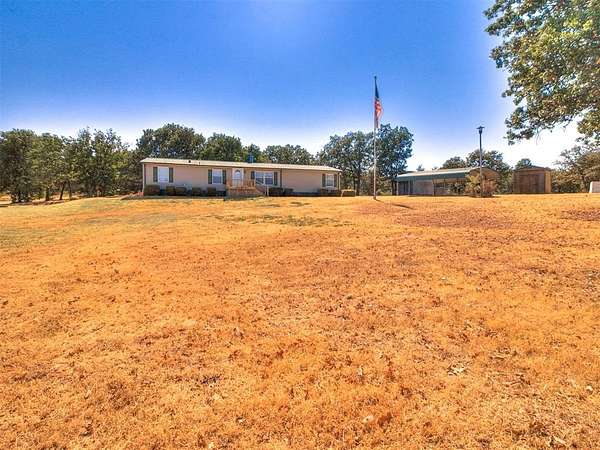 5.18 Acres of Land with Home for Sale in Harrah, Oklahoma
