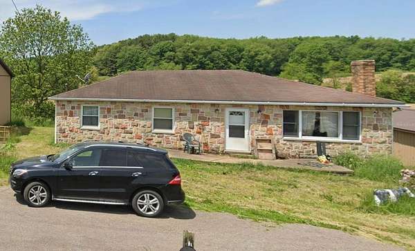6.7 Acres of Land with Home for Auction in Wellsville, Ohio