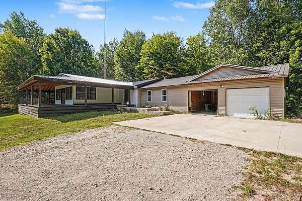 10 Acres of Recreational Land with Home for Sale in Coleman, Michigan