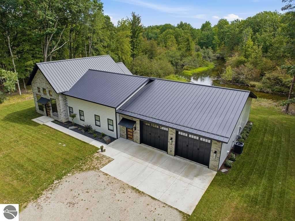 3 Acres of Land with Home for Sale in Canadian Lakes, Michigan