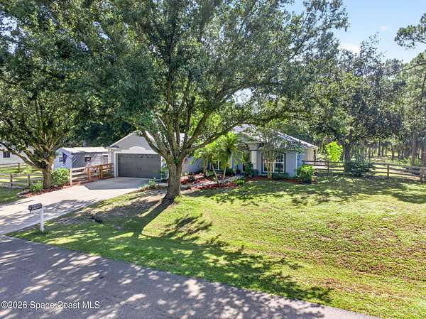 2 Acres of Land with Home for Sale in Palm Bay, Florida