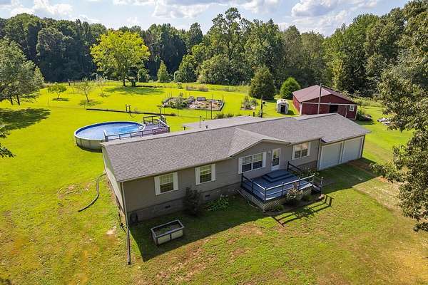 14.3 Acres of Land with Home for Sale in Paris, Tennessee