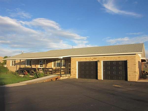 5 Acres of Land with Home for Sale in Cody, Wyoming