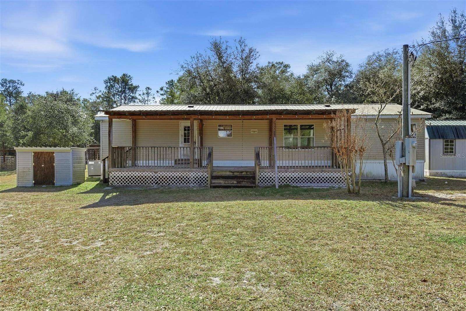 9.39 Acres of Land with Home for Sale in Florahome, Florida