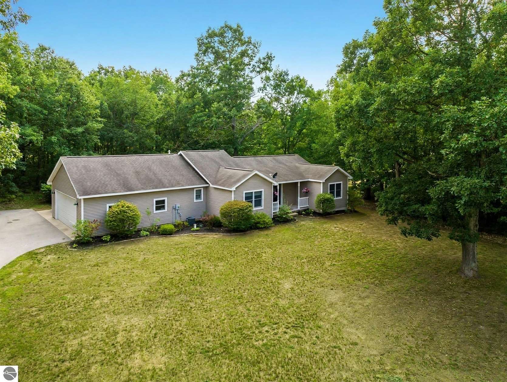 5 Acres of Land with Home for Sale in Interlochen, Michigan