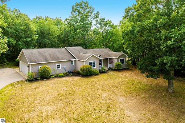 5 Acres of Land with Home for Sale in Interlochen, Michigan