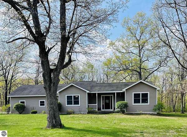 5 Acres of Land with Home for Sale in Interlochen, Michigan
