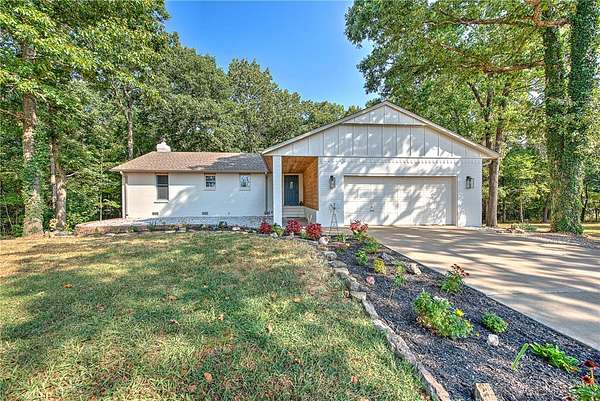 5.88 Acres of Land with Home for Sale in Lowell, Arkansas