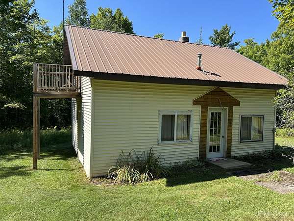 10 Acres of Recreational Land with Home for Sale in Skandia, Michigan