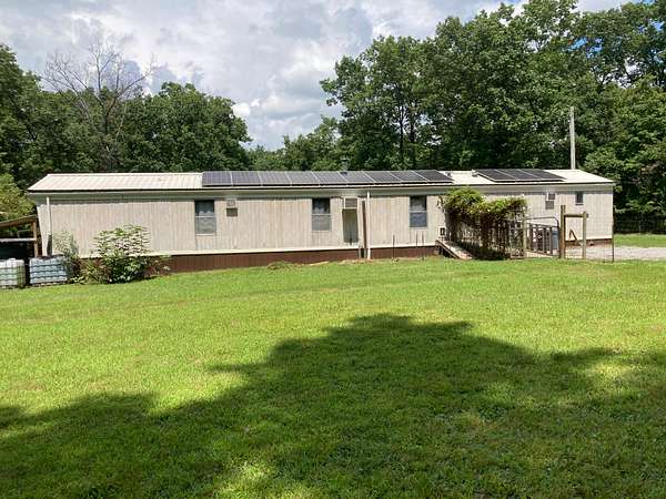 1.5 Acres of Land with Home for Sale in Deer Lodge, Tennessee