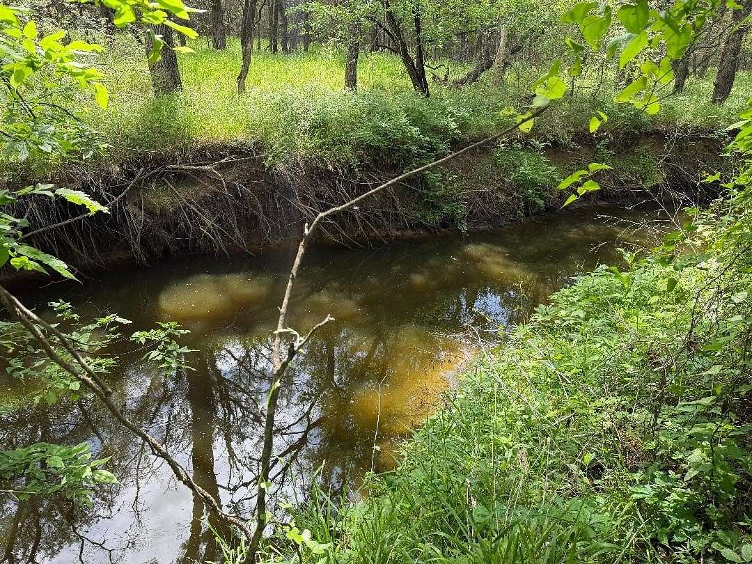 24.5 Acres of Recreational Land with Home for Sale in Aquilla, Texas