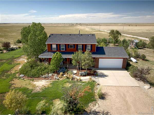 4.53 Acres of Land with Home for Sale in Briggsdale, Colorado