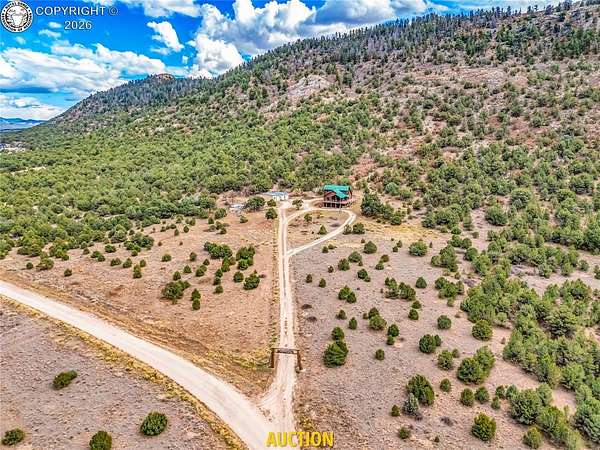 35.1 Acres of Land with Home for Auction in Westcliffe, Colorado