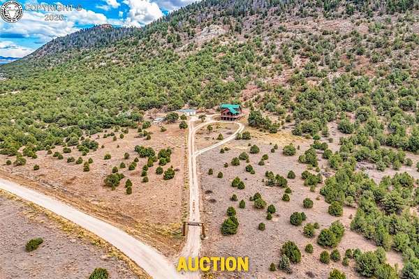 35.1 Acres of Land with Home for Auction in Westcliffe, Colorado