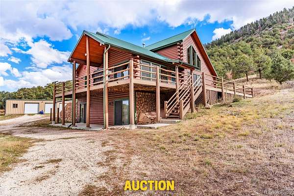 35.1 Acres of Land with Home for Auction in Westcliffe, Colorado