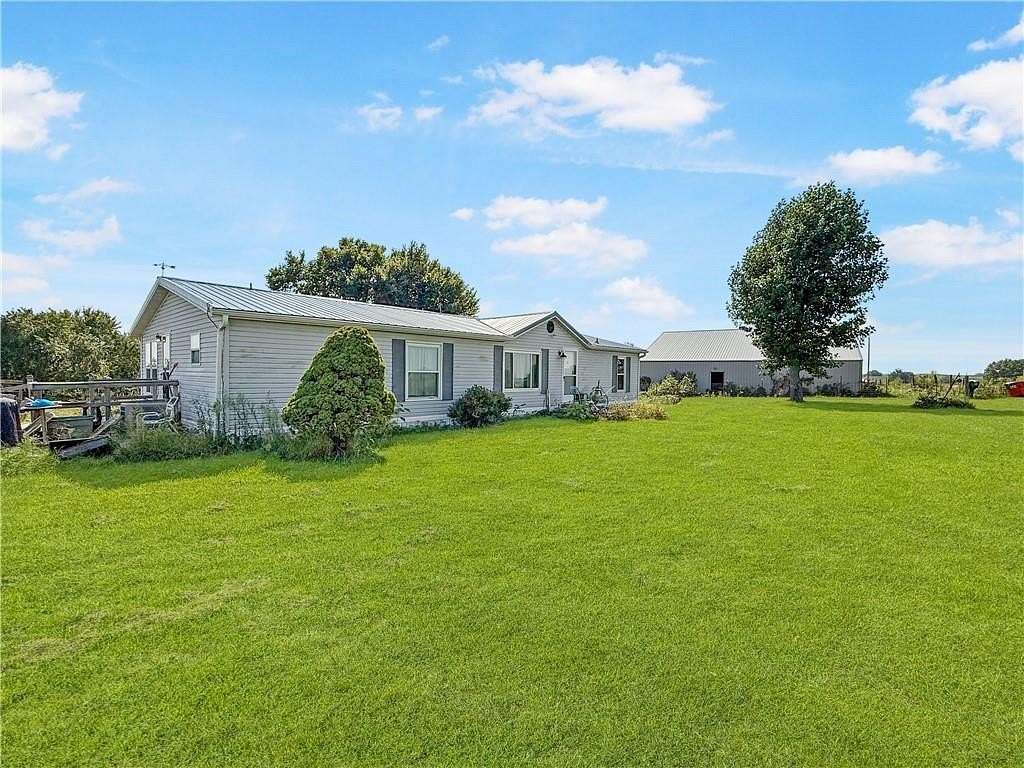 10.4 Acres of Land with Home for Sale in Higginsville, Missouri