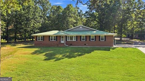 4.1 Acres of Land with Home for Sale in Silver Creek, Georgia