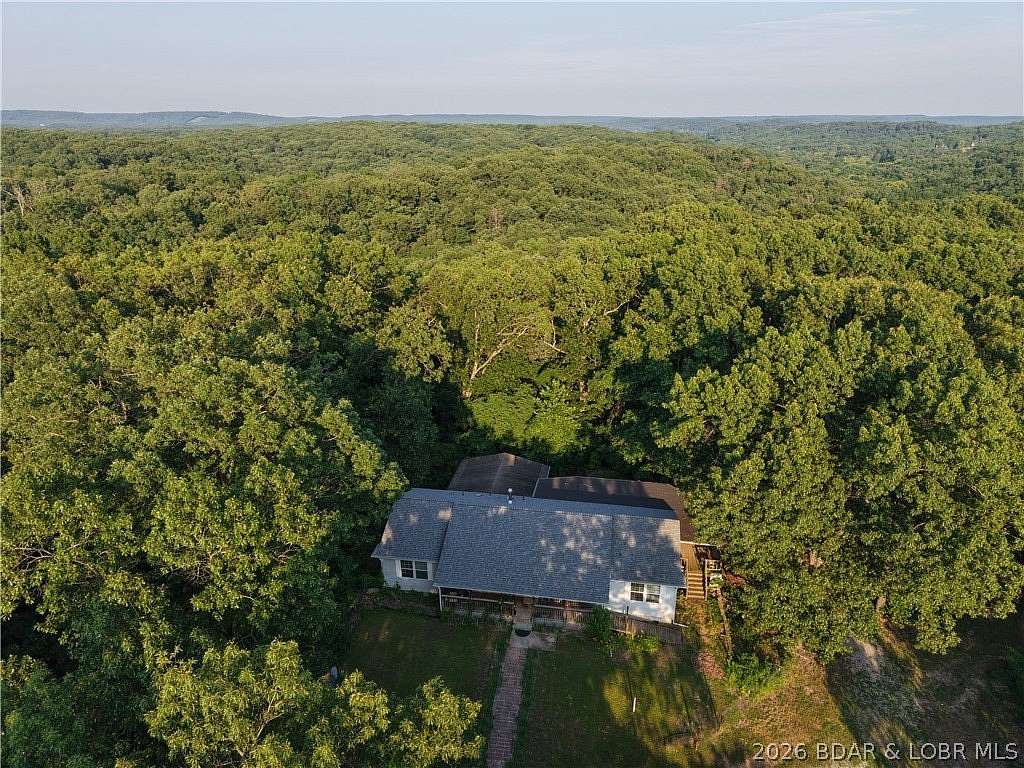 97.7 Acres of Recreational Land with Home for Sale in Stover, Missouri