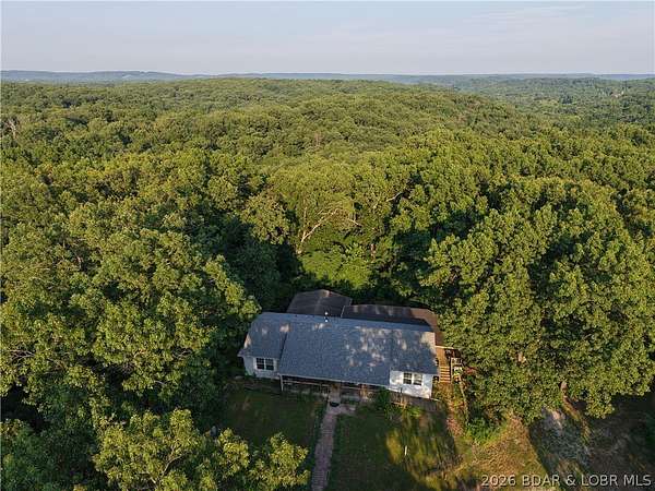 97.7 Acres of Recreational Land with Home for Sale in Stover, Missouri