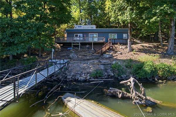 0.71 Acres of Land with Home for Sale in Roach, Missouri
