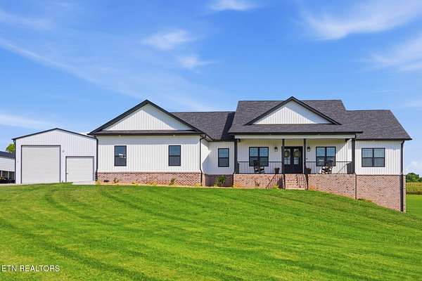 4.64 Acres of Land with Home for Sale in Friendsville, Tennessee