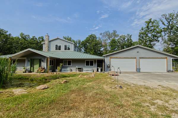 6.9 Acres of Land with Home for Sale in Urbana, Missouri