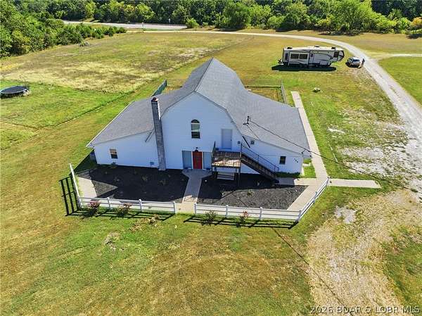 1.83 Acres of Land with Home for Sale in Macks Creek, Missouri