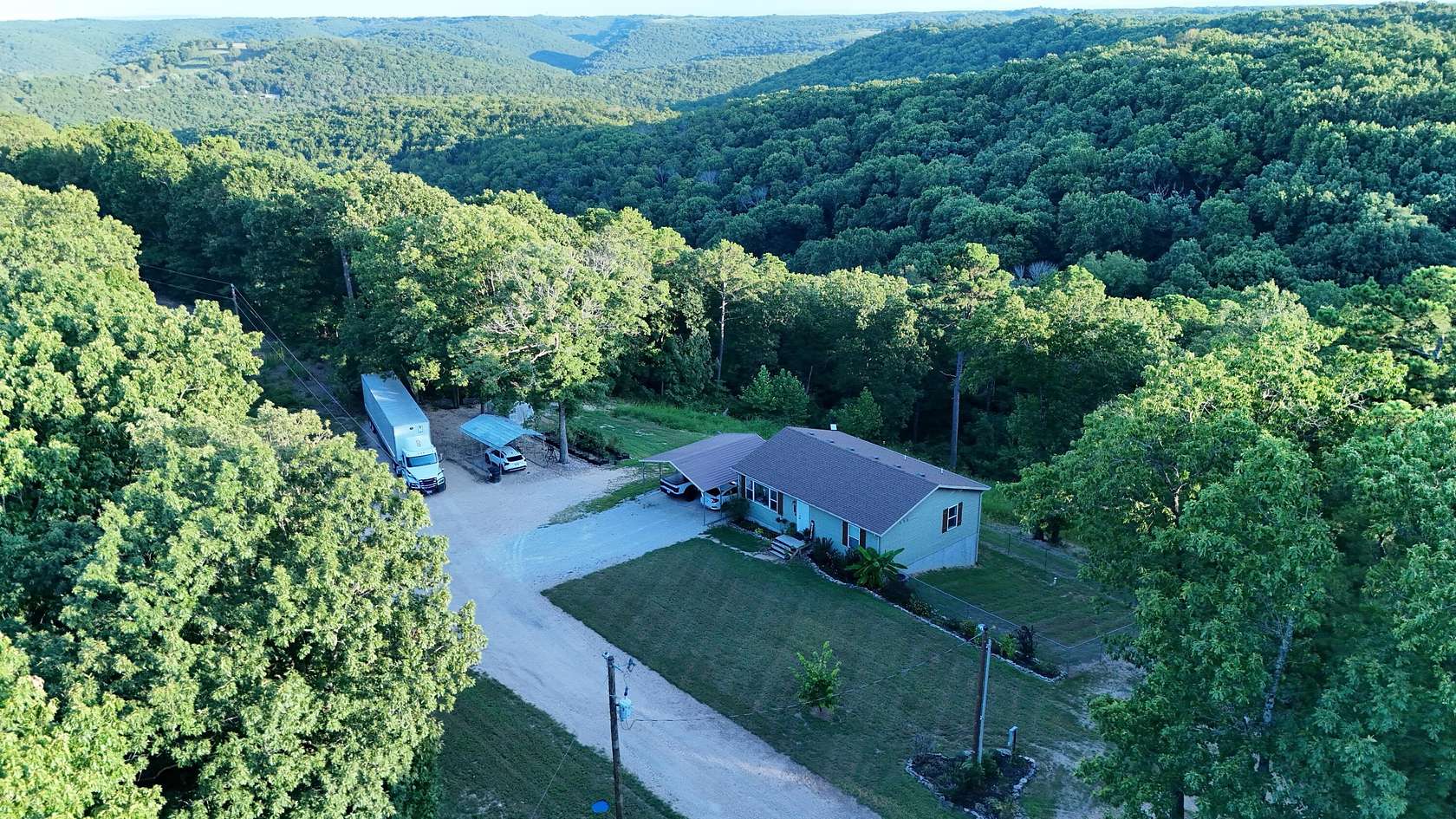 5 Acres of Land with Home for Sale in Lampe, Missouri