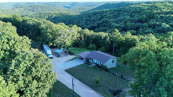 5 Acres of Land with Home for Sale in Lampe, Missouri