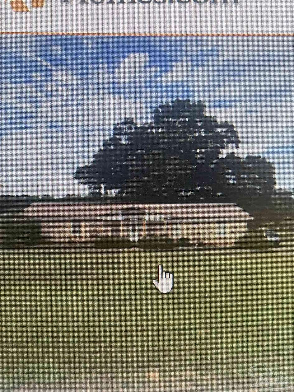30.7 Acres of Agricultural Land with Home for Sale in Jay, Florida