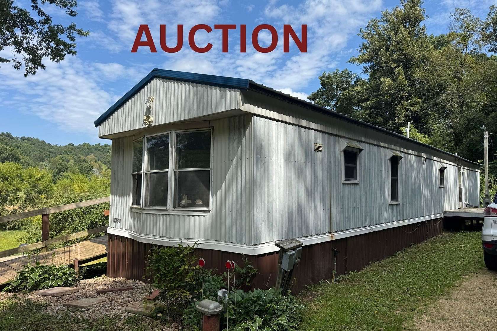 4.83 Acres of Land with Home for Auction in Hill Point, Wisconsin