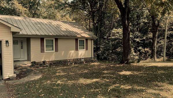 9.38 Acres of Land with Home for Sale in Russellville, Alabama