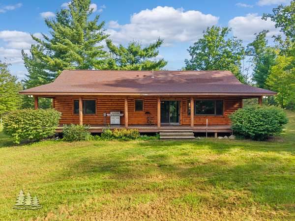 9.56 Acres of Land with Home for Sale in Comins, Michigan